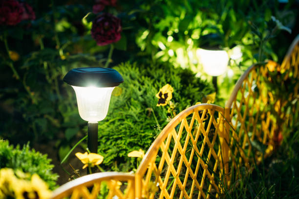 Close-up of solar-powered garden lights in landscaped front yard