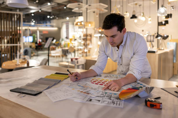 Professional lighting consultant planning interior lighting for a luxury residence