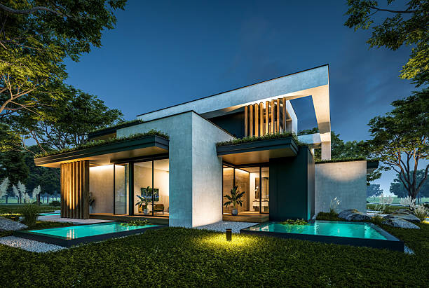 Contemporary villa in India with façade and garden lighting at night