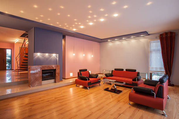 Living room with recessed LED ceiling downlights and cove lighting in India