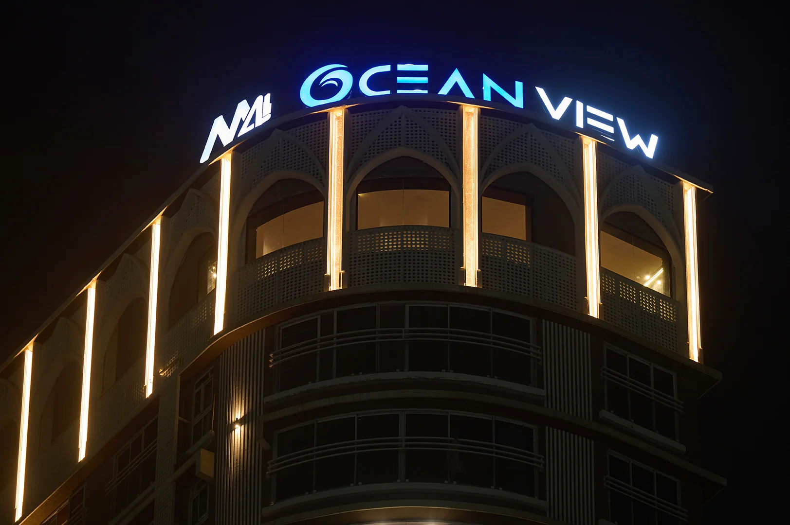 Architectural façade lighting on commercial building using vertical LED uplights